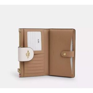 Coach Tan Wristlet with Pink Floral Design